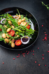 white bean salad , tomato, leaves lettuce mix fresh healthy meal food diet snack on the table copy space food background 
