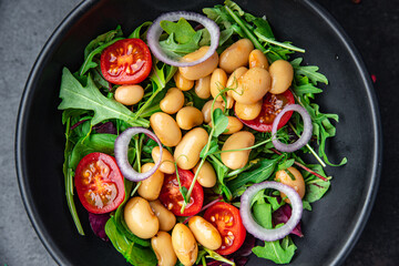 white bean salad , tomato, leaves lettuce mix fresh healthy meal food diet snack on the table copy space food background 