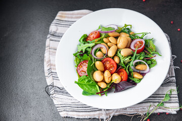 white bean salad , tomato, leaves lettuce mix fresh healthy meal food diet snack on the table copy space food background 