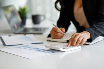 Financial Businesswoman working at office with documents on his desk, doing planning analyzing the financial report, business plan investment, finance analysis concept