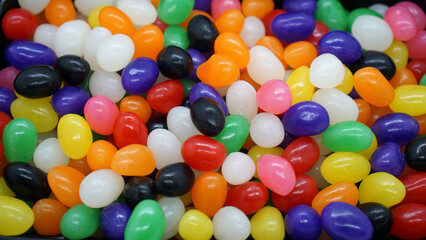 Fototapeta na wymiar Colorful jelly bean background for Easter or candy lovers. 