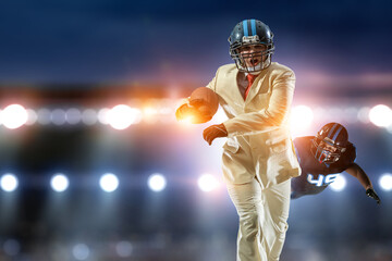 Businessman acting as american football players