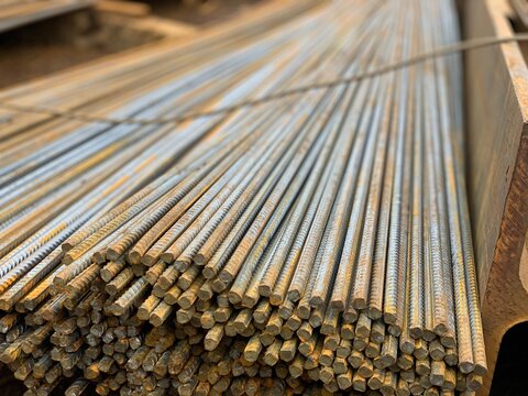 Full Frame Shot Of Stacked Metal Rods At Construction Site