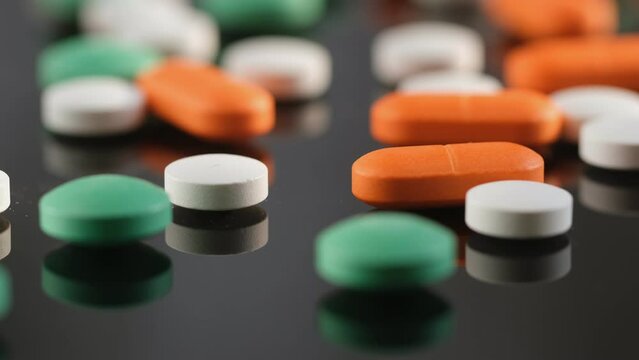 colorful pills - Opioid and prescription medication addiction epidemic or crisis - concept