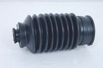 Automobile axle boots or CV joint boots, some auto spare parts against white background