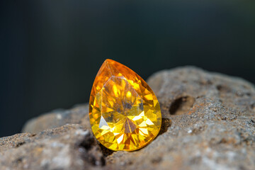 Natural Sapphire gemstone, Jewel or gems on black shine color, natural yellow gemstones on stone