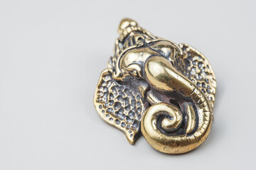 Brass Ganesh isolated from white background.