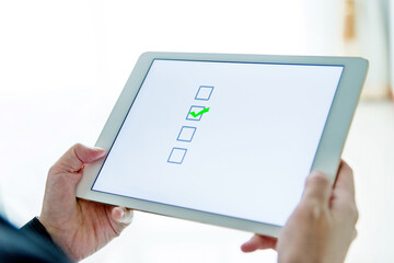 People using digital tablet  voting online