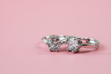beautiful diamond earrings. Close-up of white diamond earrings.

