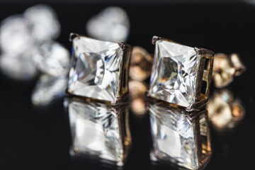 beautiful diamond earrings. Close-up of white diamond earrings.
