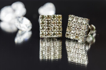 beautiful diamond earrings. Close-up of white diamond earrings.
