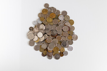 Different coins from all over the world collection on white isolated background