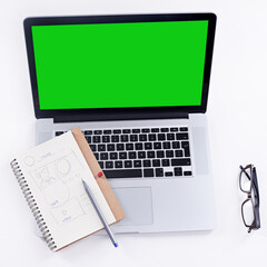 Tools to get the job done. Shot of a laptop with a green screen.