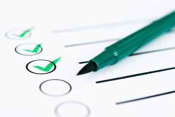 Checklist marked by a green pen