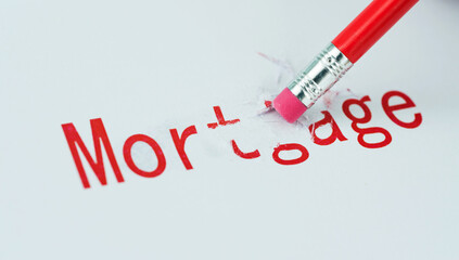 Close up of erase mortgage text from paper
