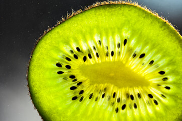 macro photography of ripe fresh kiwi slice. close-up texture kiwi