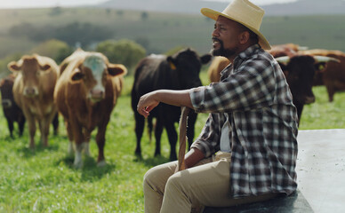 Have patience, you cant hurry the crops. Shot of a mature man working on a cow farm. - obrazy, fototapety, plakaty