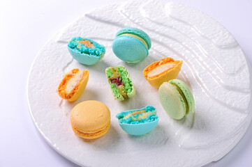 Fototapeta na wymiar colorful macaroons on a white plate