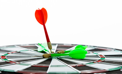 Red dart arrow hitting in the center of the dartboard