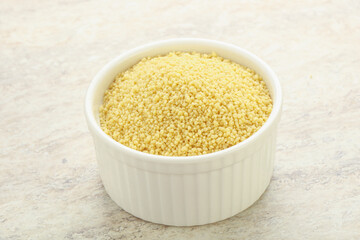 Raw couscous in the bowl