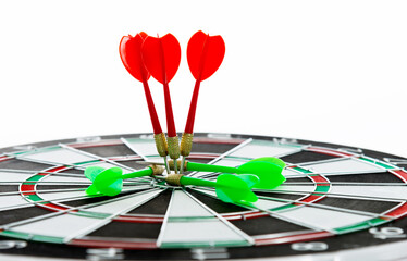Red dart arrow hitting in the center of the dartboard