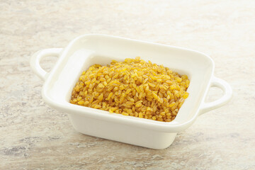 Raw bulgur in the bowl