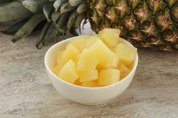 Marinated pineapple slices in the bowl