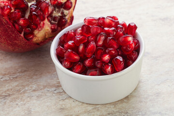 Ripe red Pomegranate seeds in the bowl