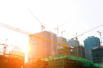 Construction site with crane at sunset