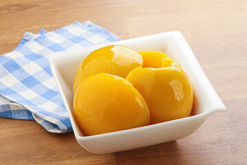 Sweet canned peaches with syrope