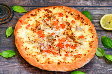   Home made Tuna fish   italian style pizza.   Parmesan cheese, mozzarella  , mushrooms,olives   cherry tomatoes and ,fresh basil