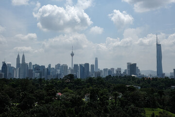 Fototapeta na wymiar A noise effect picture of hazy and foggy cloudy Kuala Lumpur City with iconic tower insight.