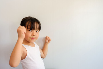 Photo of a half-body girl raising her hand during an evening exercise with a bright face in a strong competition.