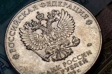 Banknotes and coins of the Russian ruble.The inscription Bank of Russia and the Russian Federation on the coin