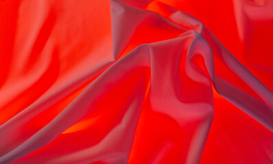 Red material as an abstract background.