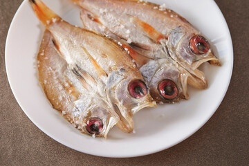 salted dried fish on a plate