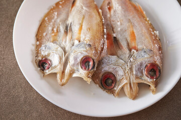 salted dried fish on a plate