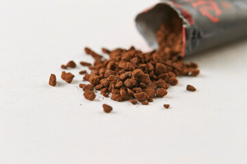 instant coffee granules on a white background