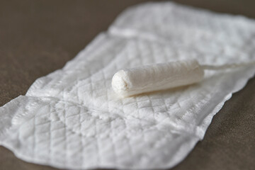 Tampon, feminine hygiene products on marble background