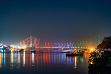 Howrah bridge on the river Hooghly with the twilight sky. The cantilever bridge is considered the busiest bridge in India.