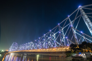 Howrah bridge on the river Hooghly with the twilight sky. The cantilever bridge is considered the...