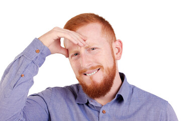 Red-haired man with beard and headache looking at the camera. High quality photo