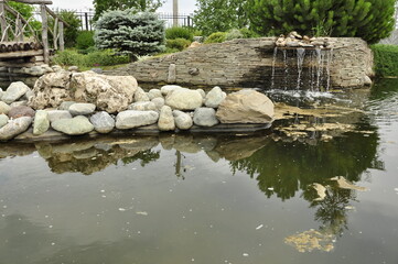 Garden pond. Pond in landscape design.