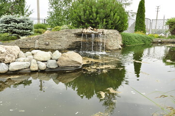 Garden pond. Pond in landscape design.