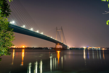 Fototapeta na wymiar Vidyasagar Setu is the longest cable-stayed bridge and the second on Hooghly River at the dusk time in Kolkata, West Bengal, India.