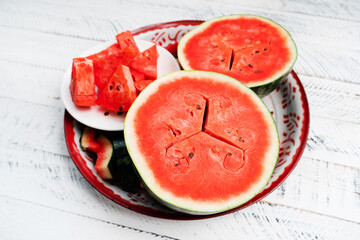 sweet fresh watermelon on white wooden background