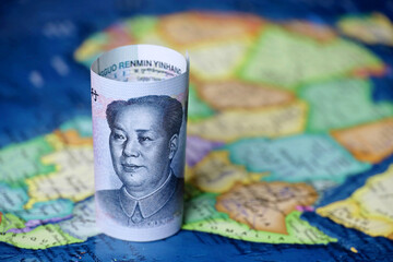 Chinese yuan on the map of Africa continent. Trading between China and african countries, tourism,...