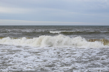 Baltic sea seascape view of shoreline and small waves.