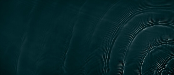 Black transparent clear calm water surface texture with ripples, splashes. Abstract nature banner...
