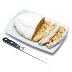 Sliced Traditional Christmas stollen cake with marzipan and dried fruit isolated on ceramic plate